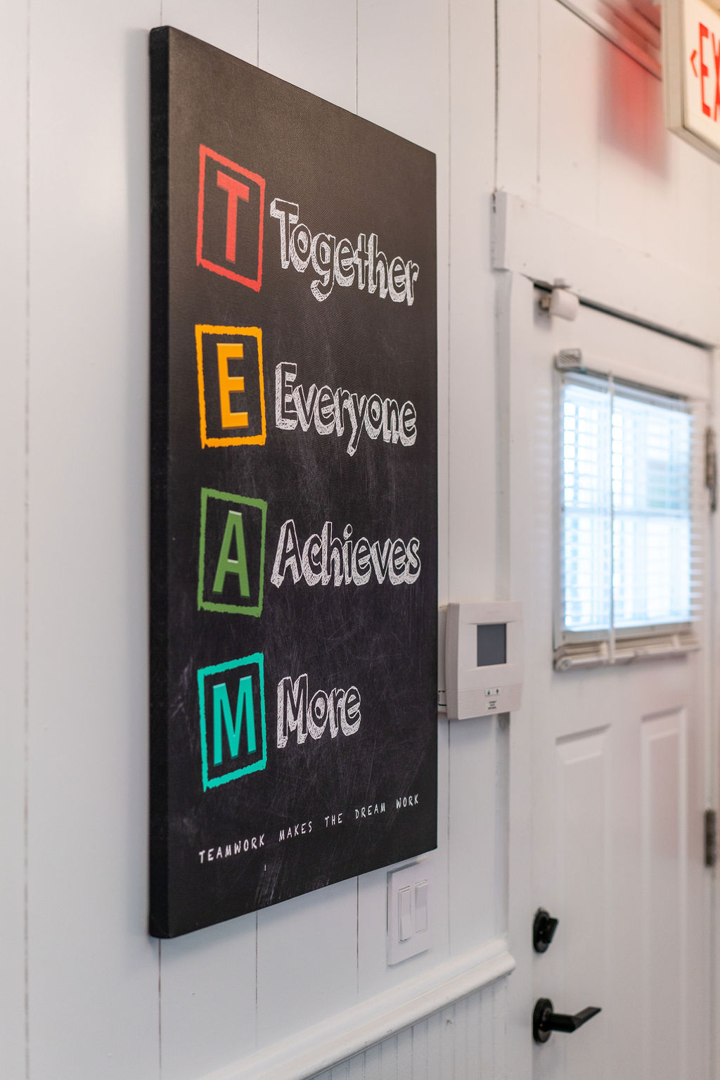 TEAM wall sign inside the Hilson Ink shop — Contact / Request a Quote